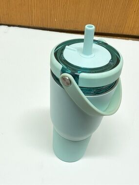 Brumate 35 ounce mint colored traveling mug with straw